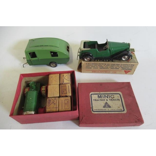 236 - Minic clockwork tractor and trailer, caravan and open sports saloon, rubber track and tyres fatigued... 