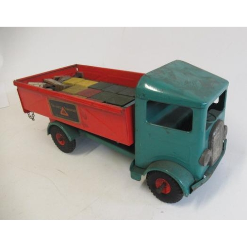 276 - Triang Transport large steel tipper truck finished in green and red, with wooden blocks load, some r... 