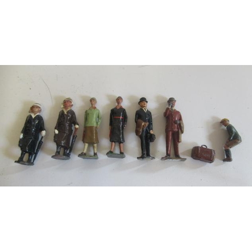 321 - Britains railway passengers including seated boy and suitcase, G