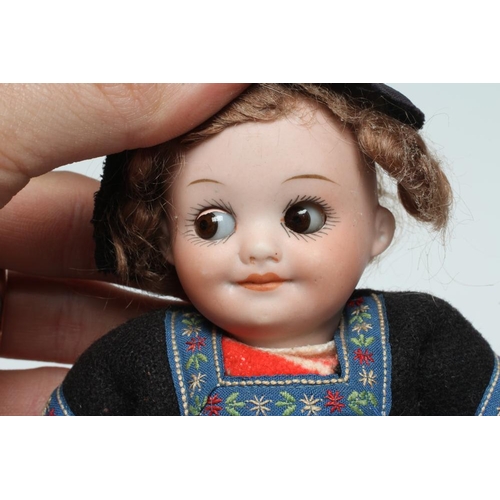 4 - An Armand Marseille googlie eye Dutch girl, with bisque socket head, brown glass sleeping eyes, clos... 