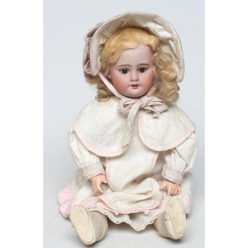 49 - A French bisque socket head doll, possibly Bru, with brown glass sleeping eyes, open mouth, teeth, b... 