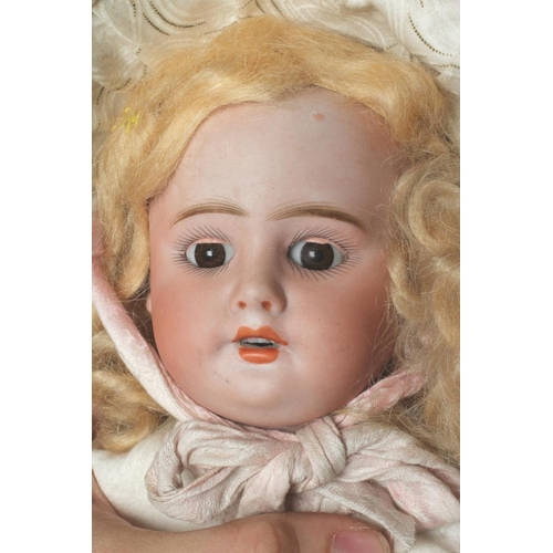 49 - A French bisque socket head doll, possibly Bru, with brown glass sleeping eyes, open mouth, teeth, b... 