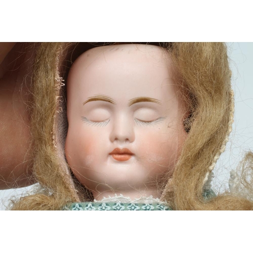 58 - A Carl Bergner three faced bisque head doll, with sleeping, laughing and crying faces, glass fixed e... 