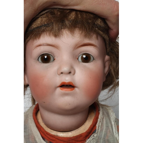 6 - A Franz Schmidt & Co. bisque socket head doll, with brown glass sleeping eyes, open mouth, applied t... 