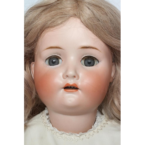 74 - A J D Kestner bisque socket head doll, with blue glass paperweight sleeping eyes, open mouth, teeth,... 