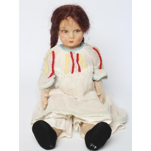 8 - A pre-war Lenci girl doll, with felt head and arms, painted features, brown wig, jointed body, strai... 