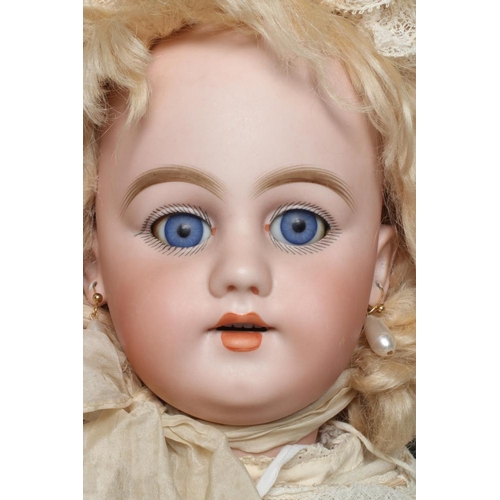 81 - A Simon & Halbig bisque socket head doll, with blue glass sleeping eyes, open mouth, teeth, pierced ... 