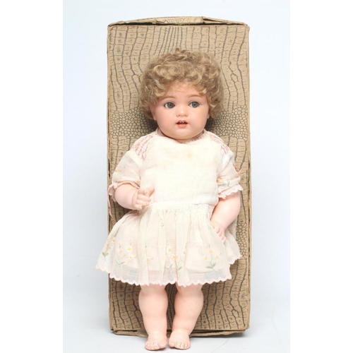 89 - A fantastic condition Kammer & Reinhardt celluloid socket head doll, with blue glass flirty eyes, sl... 