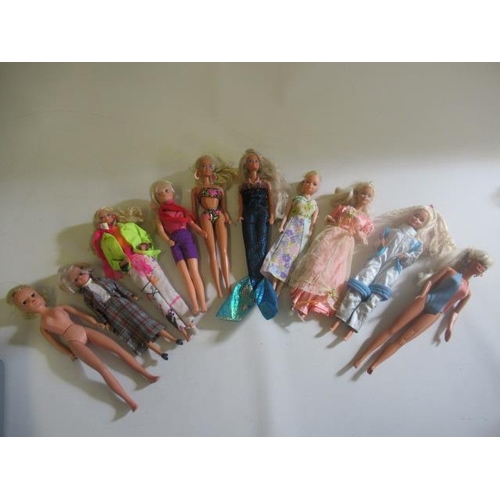 112 - A collection of Barbie & Sindy dolls, comprising four vintage Barbies, one later Barbie, one with da... 