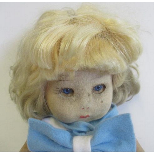 12 - A Chad Valley Bambina doll, felt construction, blue glass fixed eyes, blond wig, jointed body, label... 