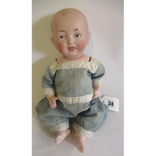 38 - A Kestner bisque character boy, with moulded and painted features, open mouth, bent limb composition... 