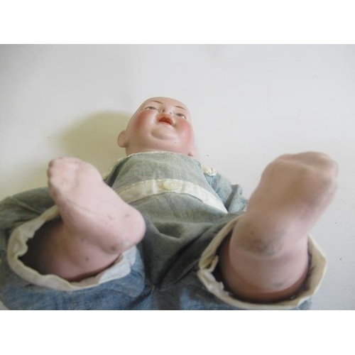 38 - A Kestner bisque character boy, with moulded and painted features, open mouth, bent limb composition... 