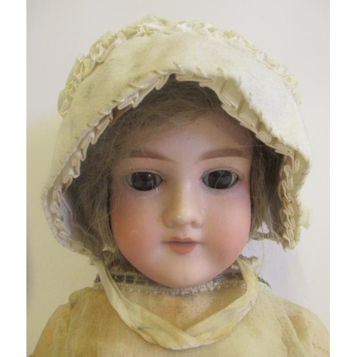 66 - An Armand Marseille bisque socket head doll, with brown glass sleeping eyes, open mouth, teeth, brow... 