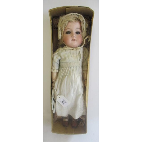 67 - An Armand Marseille bisque socket head doll, with blue glass fixed eyes, open mouth, teeth, blond wi... 