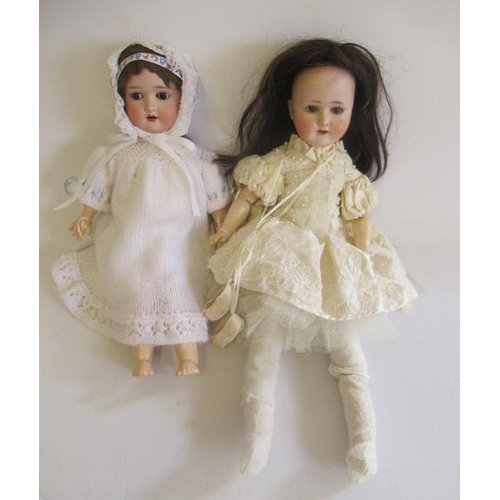 70 - Two Simon & Halbig bisque socket head dolls, with brown glass sleeping eyes, open mouths, teeth, woo... 