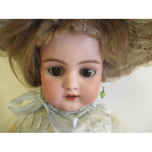 73 - A Simon & Halbig bisque socket head doll, with brown glass sleeping eyes, open mouth, teeth, pierced... 