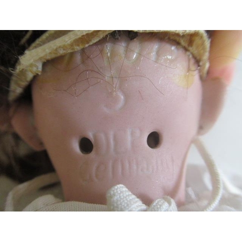 75 - A Simon & Halbig bisque socket head doll, with brown glass sleeping eyes, open mouth, teeth, pierced... 