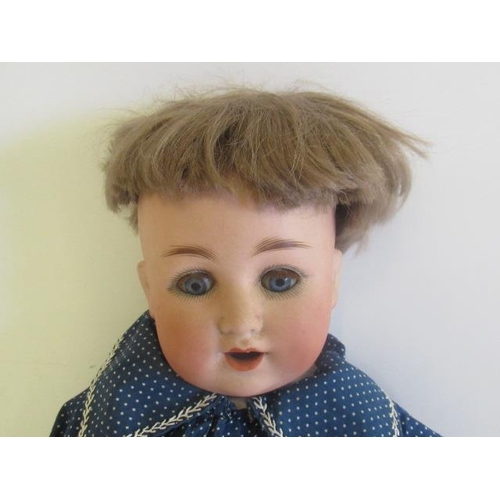 79 - A Schützmeister & Quendt bisque socket head character doll, with blue glass sleeping eyes, open mout... 