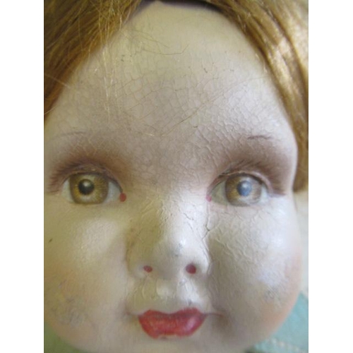 86 - A Deans Rag Book Co girl doll, with papier mache head, painted features, auburn wig, felt body, stra... 