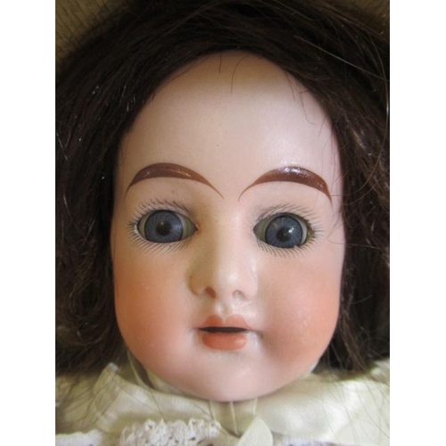 90 - An Cuno & Otto Dressel bisque shoulder head doll, with blue glass sleeping eyes, open mouth, teeth, ... 