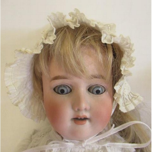 92 - A Simon & Halbig bisque socket head doll, with blue glass sleeping eyes, open mouth, teeth, blond wi... 