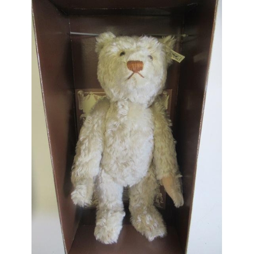 129 - A boxed Steiff British Collector's 1911 replica teddy bear, no. 01298, with light plush, ear button,... 