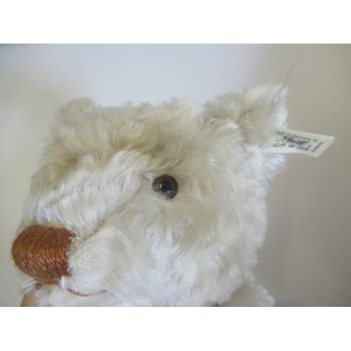 129 - A boxed Steiff British Collector's 1911 replica teddy bear, no. 01298, with light plush, ear button,... 