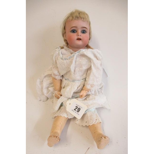 29 - A Kammer & Reinhardt bisque socket head doll, with blue glass sleeping eyes, open mouth, applied top... 