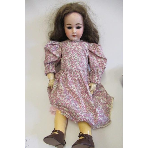 3 - An Armand Marseille bisque socket head doll, with brown glass sleeping eyes, open mouth, top teeth, ... 