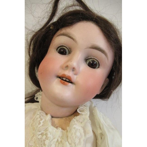 31 - A Max Handwerck bisque socket head doll, with brown glass sleeping eyes, open mouth, upper teeth, br... 