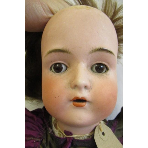 41 - A Bruno Schmidt bisque socket head doll, with brown glass sleeping eyes, open mouth, applied teeth, ... 