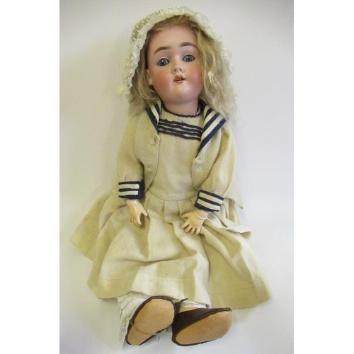 54 - A Max Handwerck bisque socket head doll, with blue glass sleeping eyes, open mouth, teeth, blond wig... 