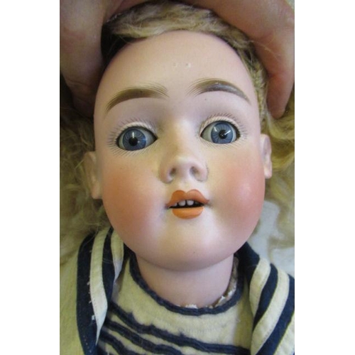 54 - A Max Handwerck bisque socket head doll, with blue glass sleeping eyes, open mouth, teeth, blond wig... 