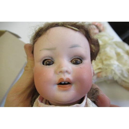 55 - A Porzellamfabrik Mengersgereuth bisque socket head doll, with brown glass sleeping eyes, open mouth... 