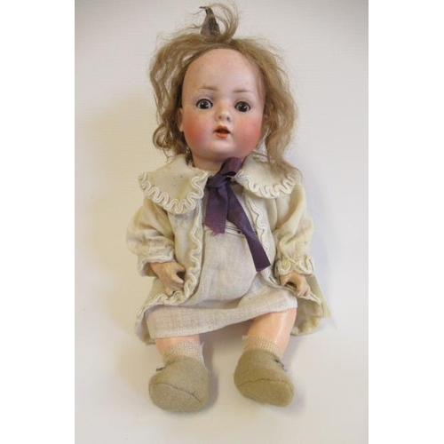 57 - A Bahr & Proschild bisque socket head doll, with brown glass sleeping eyes, open mouth, teeth, light... 