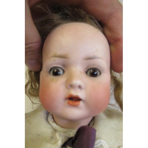 57 - A Bahr & Proschild bisque socket head doll, with brown glass sleeping eyes, open mouth, teeth, light... 