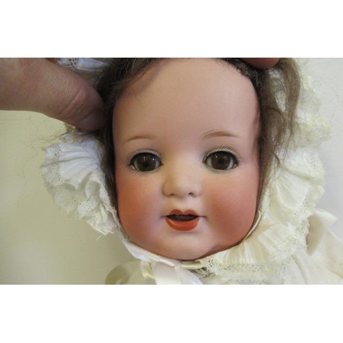 59 - An Armand Marseille Koppelsdorf bisque socket head character doll, with brown glass sleeping eyes, o... 