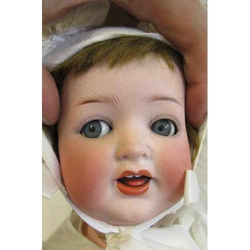 62 - A Heubach Koppelsdorf bisque socket head character doll, with blue glass flirty eyes, sleeping eyeli... 