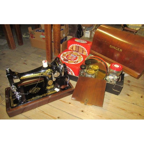 127 - SINGER SEWING MACHINE AND A BOX OF SEWING ITEMS