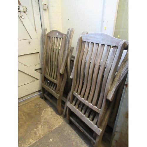 731 - FOUR TEAK FOLDING GARDEN CHAIRS