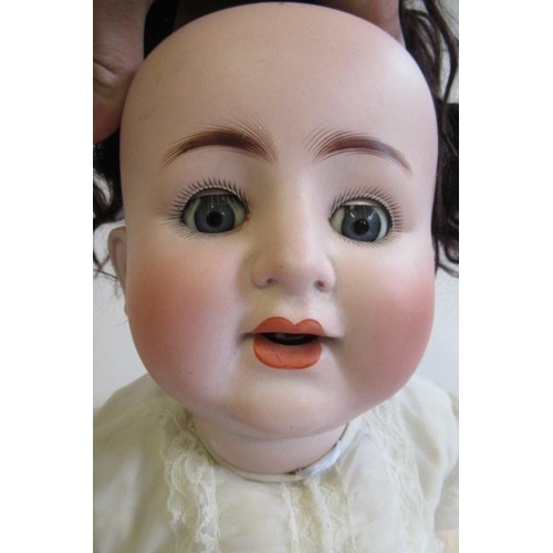 7 - An Alt, Beck & Gottschalck bisque socket head doll, with blue glass sleeping eyes, open mouth, two a... 