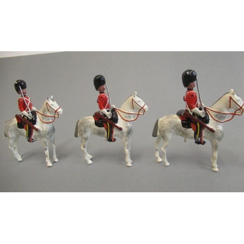 374 - Hocker mounted Royal Horse Guards, solid cast hand painted with moving arms, boxed E