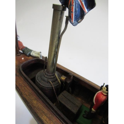 198 - A modern wooden model of a steam launch and four lead figures with flag, F