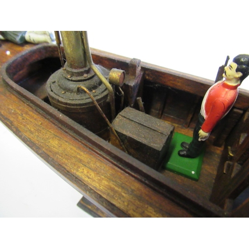 198 - A modern wooden model of a steam launch and four lead figures with flag, F