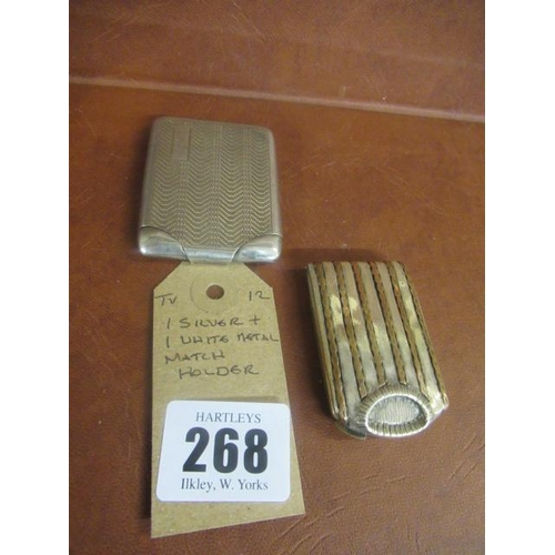 268 - ONE SILVER AND ONE WHITE METAL MATCH HOLDER