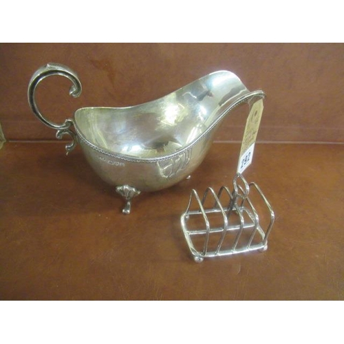 292 - SILVER SAUCE BOAT AND A SILVER TOAST RACK