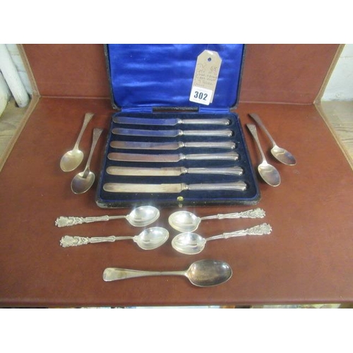 302 - CASE OF SIX SILVER HANDLED BUTTER KNIVES AND NINE SILVER SPOONS