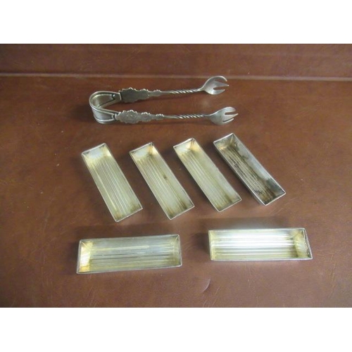 304 - SIX WHITE METAL MATCHING DISHES AND PAIR OF SUGAR TONGS