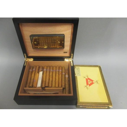 114 - A black adorini humidor with hygrometer & Boveda 75, containing 25 Monte Cristo No.4 Habana cigars, ... 