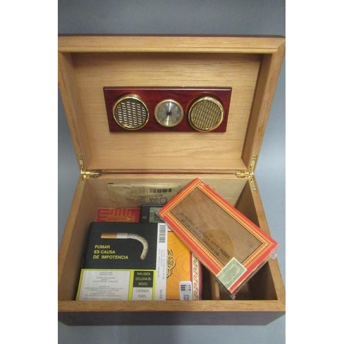 115 - A cedar humidor with hygrometer & Boveda 75, containing 5 Royal Jamaica coronas cigars and 25 Fonsec... 